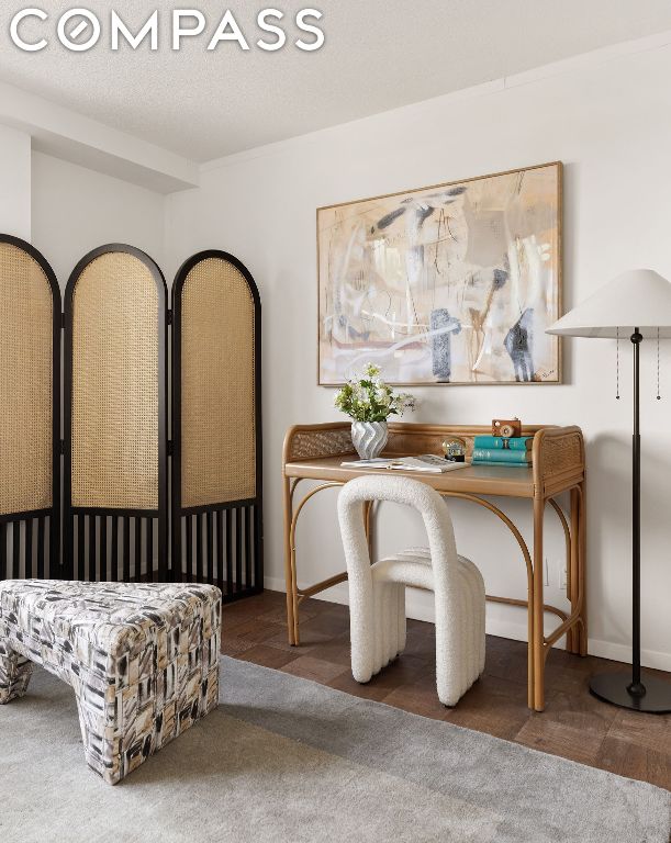 sitting room with a textured ceiling