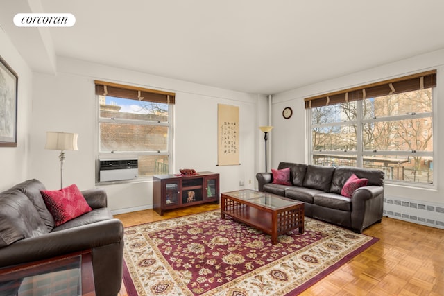 living room with radiator and light parquet flooring