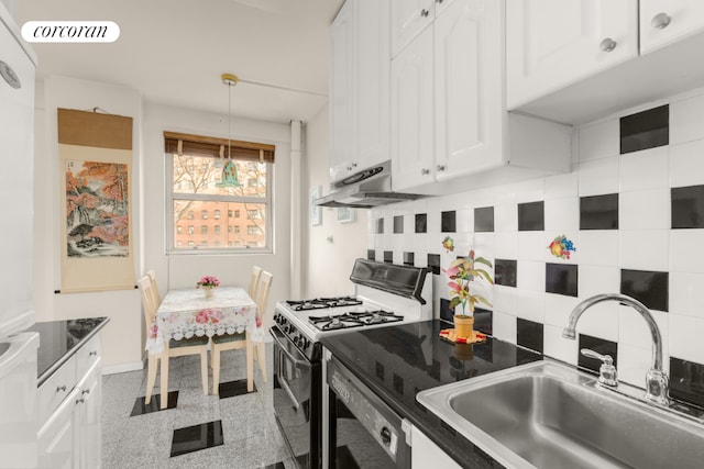 kitchen with pendant lighting, sink, black range with gas cooktop, white cabinetry, and tasteful backsplash