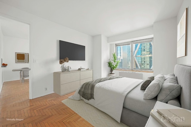 bedroom featuring light parquet flooring