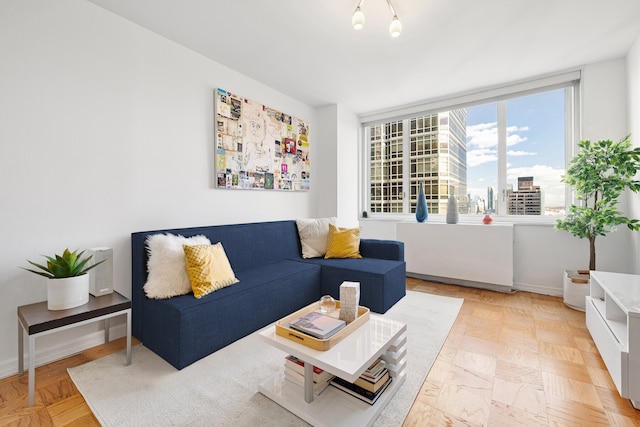 living room with a view of city and baseboards