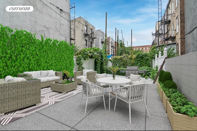 view of patio / terrace with a garden, area for grilling, an outdoor hangout area, fence, and outdoor dining space