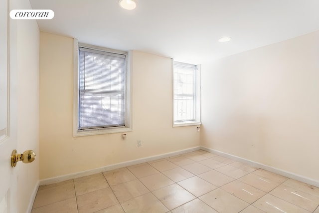 spare room featuring tile patterned flooring, visible vents, baseboards, and recessed lighting