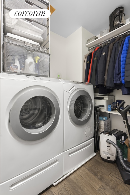 laundry room with separate washer and dryer and dark hardwood / wood-style floors