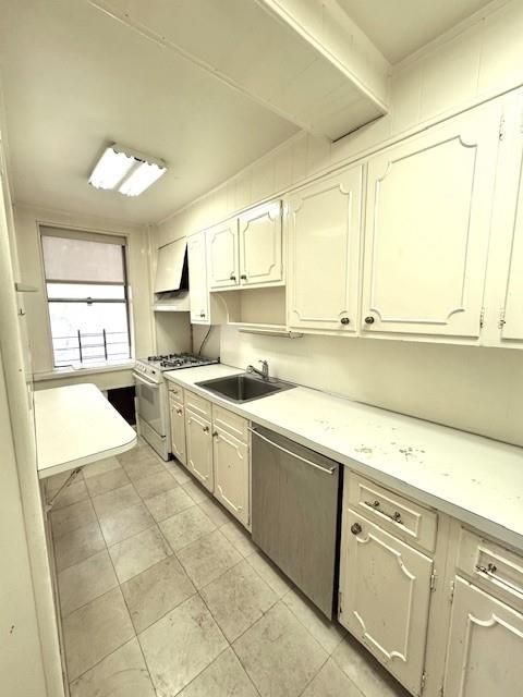 kitchen with white gas stove, a sink, light countertops, ventilation hood, and dishwasher