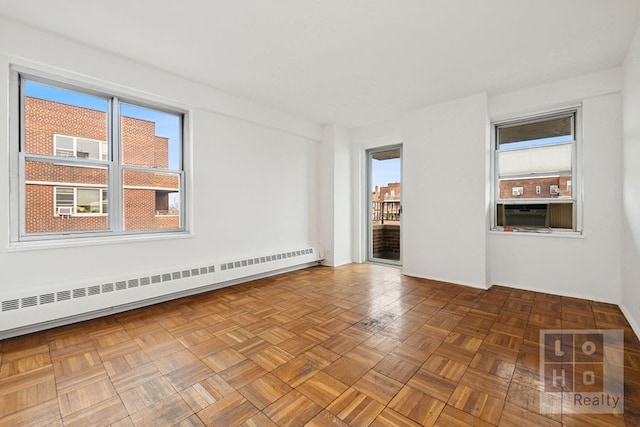 577 Grand St Unit F1904, New York City, NY 10002 - unfurnished room with a baseboard heating unit and cooling unit