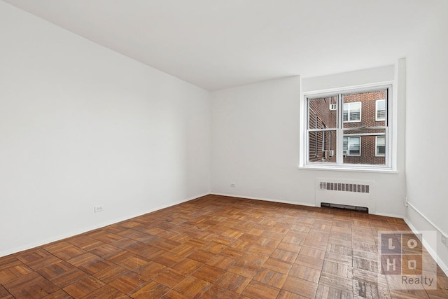 577 Grand St Unit F1904, New York City, NY 10002 - unfurnished room featuring radiator heating unit and baseboards