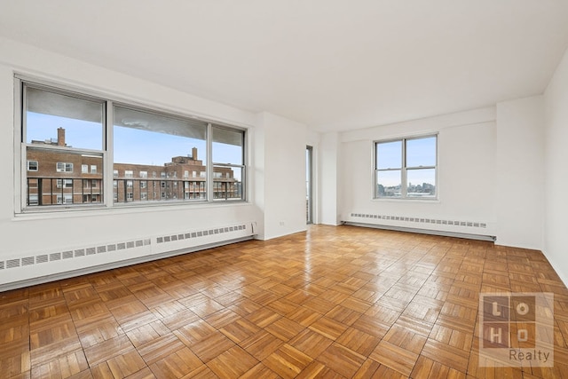 empty room featuring a baseboard radiator