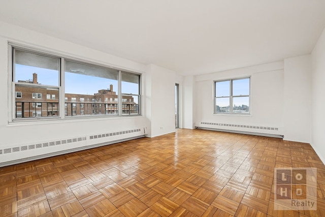 577 Grand St Unit F1904, New York City, NY 10002 - spare room with baseboard heating
