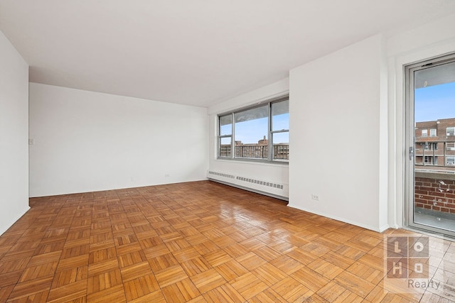 577 Grand St Unit F1904, New York City, NY 10002 - empty room with a baseboard radiator and plenty of natural light