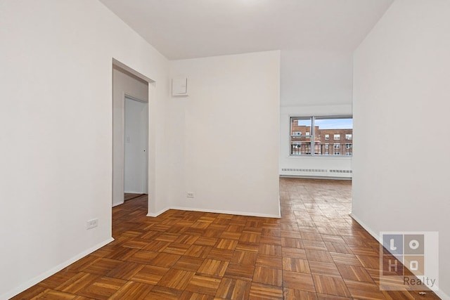 577 Grand St Unit F1904, New York City, NY 10002 - spare room with radiator and baseboards