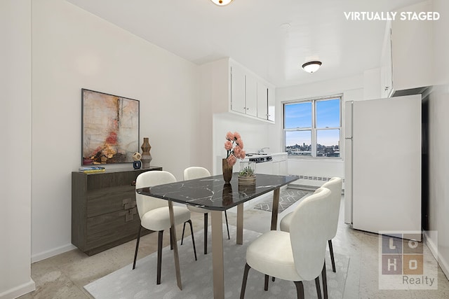 577 Grand St Unit F1904, New York City, NY 10002 - dining room featuring baseboards