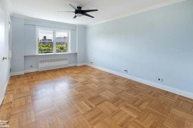 empty room featuring ornamental molding, radiator heating unit, baseboards, and ceiling fan