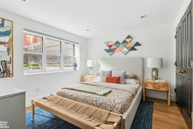 170 S 4th St, New York City, NY 11211 - bedroom with baseboards and light wood finished floors