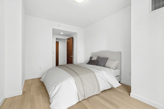 261 W 28th St Unit 3C, New York City, NY 10001 - bedroom with light wood finished floors, baseboards, and recessed lighting