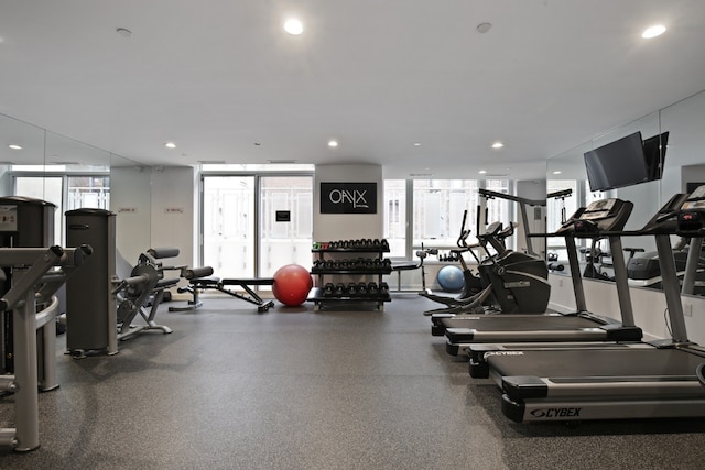 workout area featuring recessed lighting