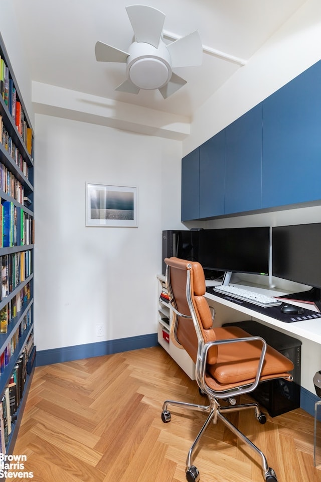 home office featuring ceiling fan and baseboards