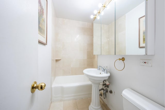 bathroom with toilet and tile patterned flooring