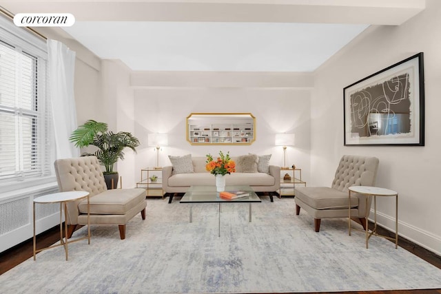 living room featuring radiator and hardwood / wood-style flooring