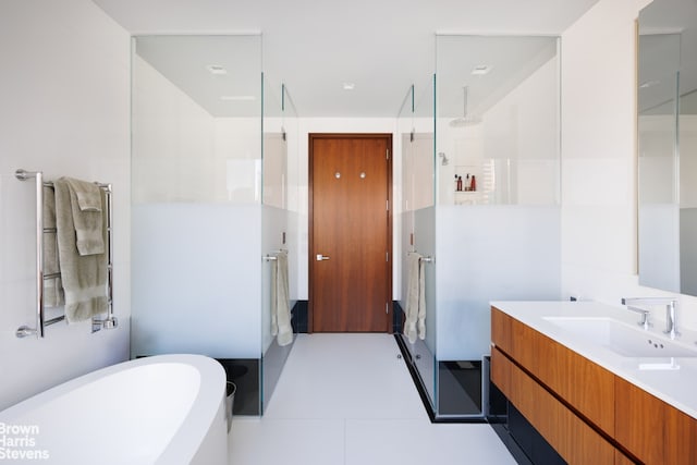 bathroom featuring tile patterned flooring, vanity, and independent shower and bath