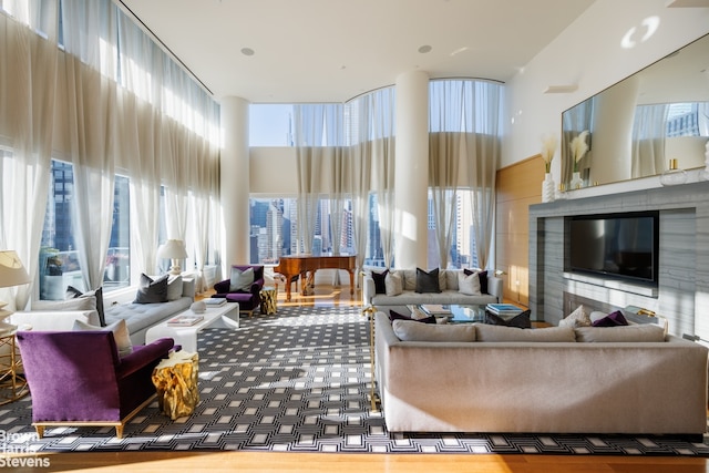 carpeted living room with a high ceiling