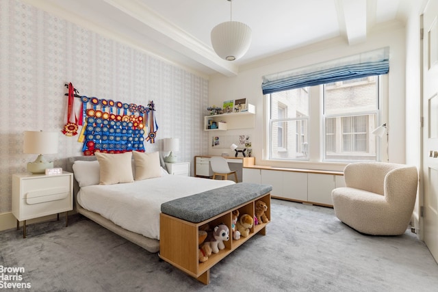 carpeted bedroom with ornamental molding and beam ceiling