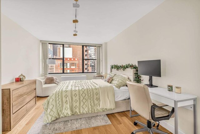 301 E 45th St Unit 10E, New York City, NY 10017 - bedroom with light hardwood / wood-style flooring