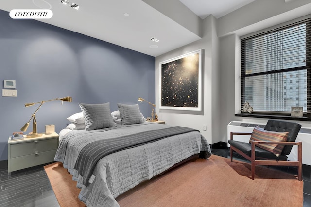 bedroom featuring dark wood-type flooring and visible vents