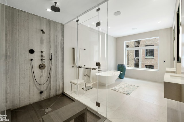 bathroom with vanity, tile patterned floors, a shower with shower door, and a freestanding bath