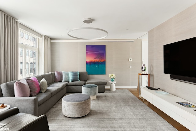 living room featuring baseboards and wood finished floors