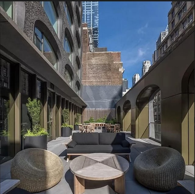 view of patio / terrace featuring outdoor lounge area and a view of city