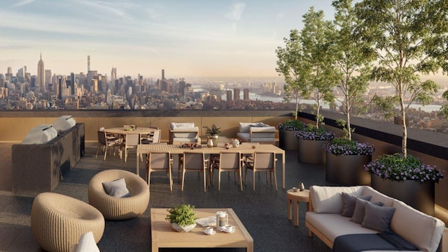patio terrace at dusk with an outdoor hangout area, outdoor dining area, and a view of city