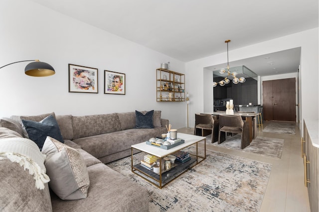 living area featuring an inviting chandelier