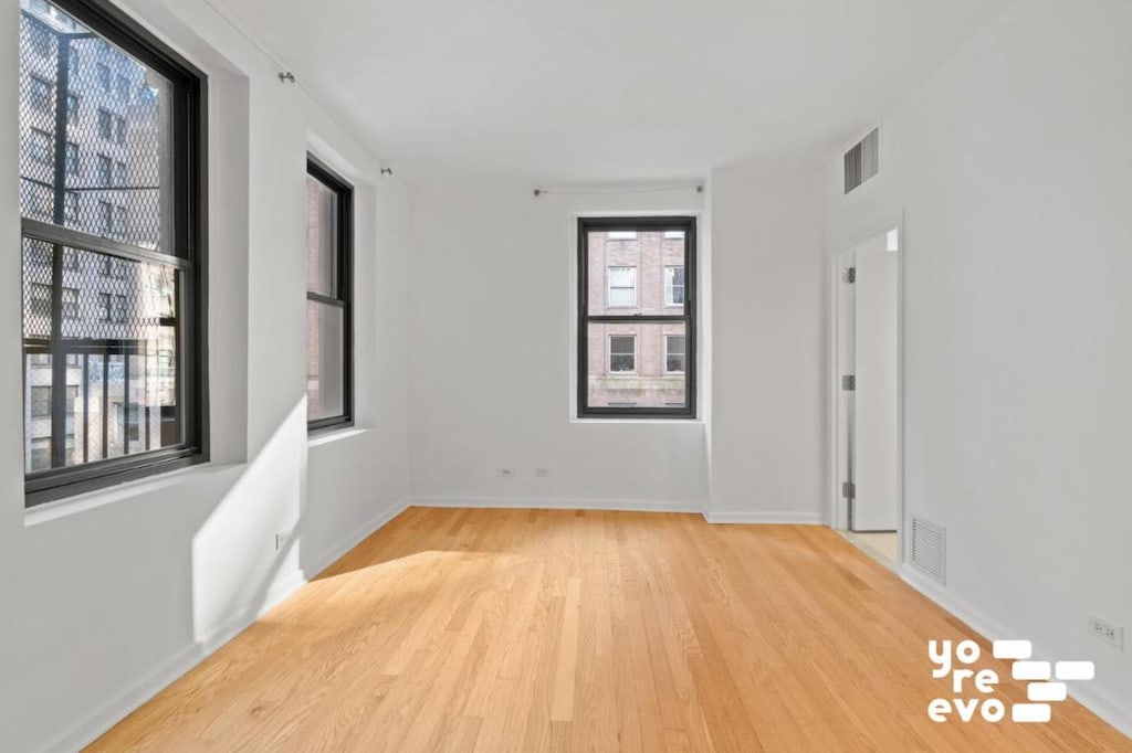 empty room with light wood-type flooring