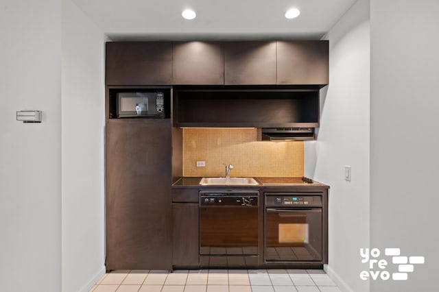 kitchen with a sink, backsplash, range hood, black appliances, and dark countertops