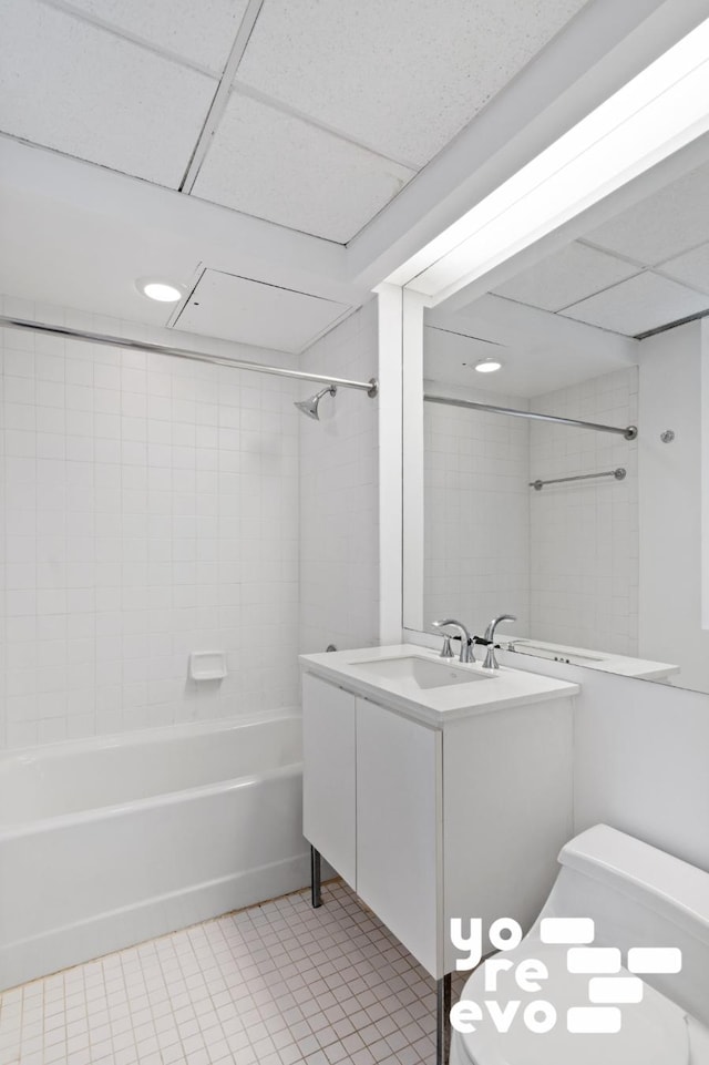 bathroom featuring toilet, tile patterned floors, shower / tub combination, and vanity