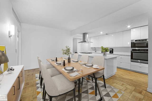 dining area featuring baseboards and recessed lighting