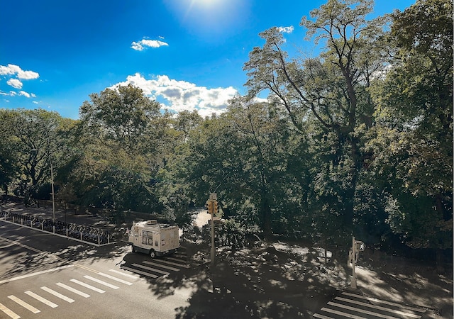 exterior space featuring a view of trees