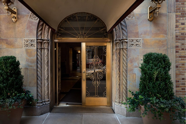 entrance to property with brick siding