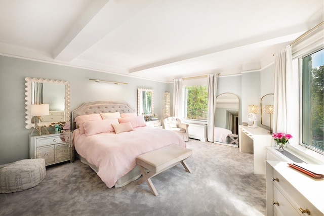 carpeted bedroom with beamed ceiling and multiple windows