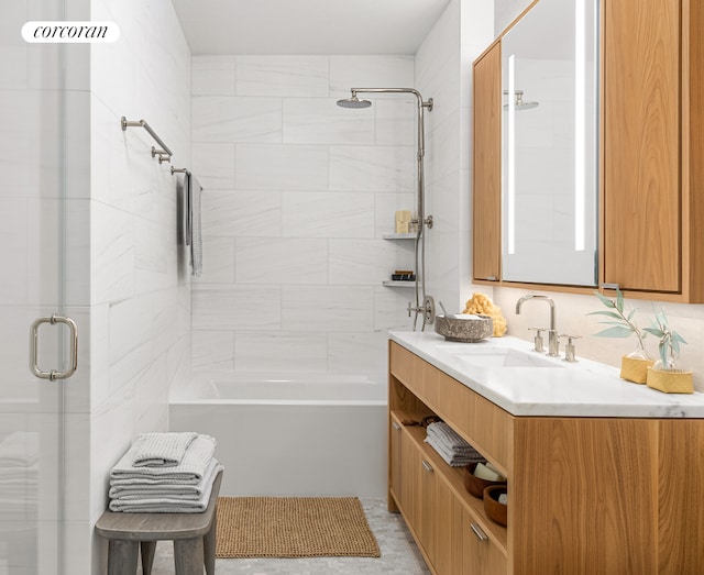 full bathroom featuring vanity and bath / shower combo with glass door