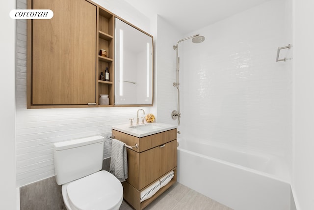 full bathroom with  shower combination, vanity, and toilet