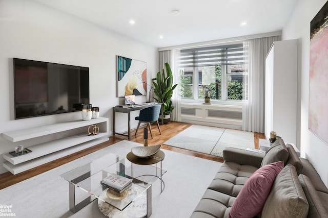 311 E 75th St Unit 3H, New York City, NY 10021 - living area with wood finished floors, an office area, and recessed lighting
