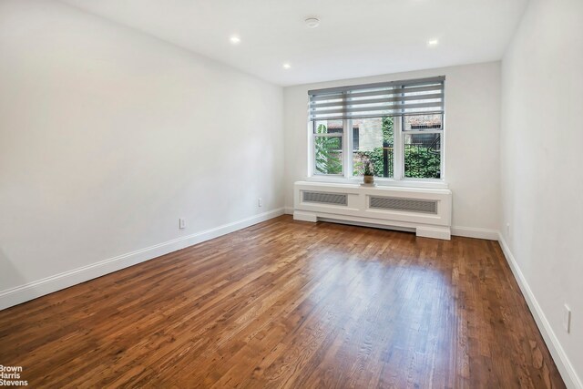 311 E 75th St Unit 3H, New York City, NY 10021 - unfurnished room with wood finished floors, baseboards, and recessed lighting