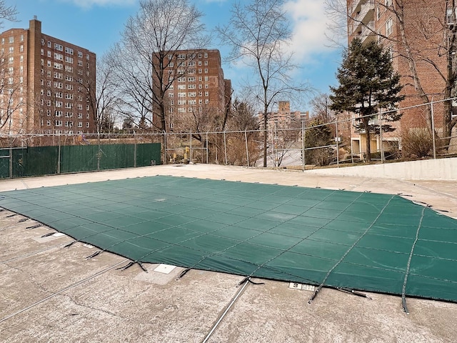 view of swimming pool with a fenced in pool, a patio, and fence