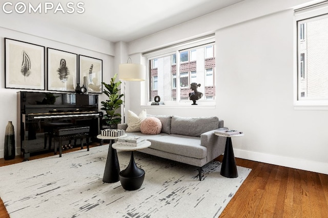 living area with hardwood / wood-style floors