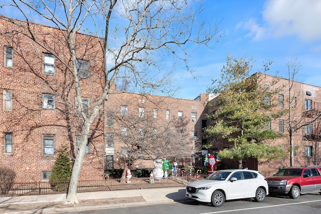 view of building exterior featuring fence