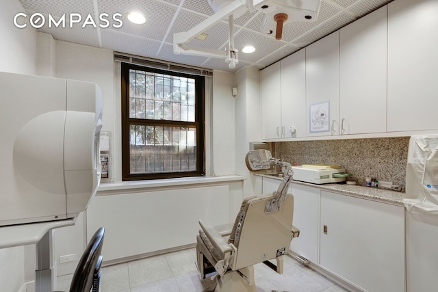 115 E 61st St Unit 1C, New York City, NY 10065 - home office featuring light tile patterned floors