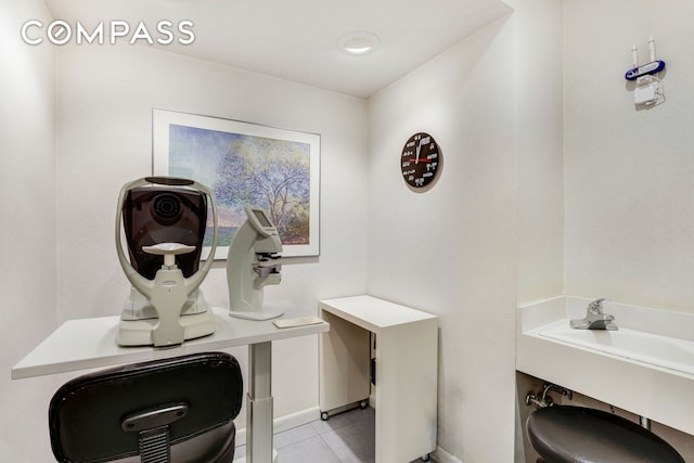 bathroom featuring tile patterned flooring and baseboards