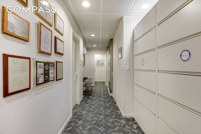 115 E 61st St Unit 1C, New York City, NY 10065 - hall featuring baseboards, recessed lighting, and dark floors